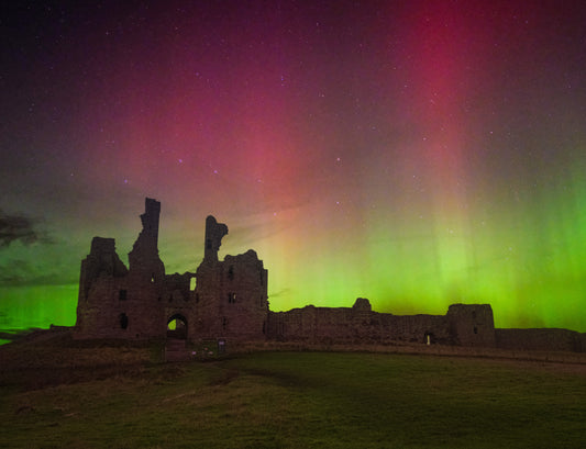 Aurora over Dunstanburgh Castle